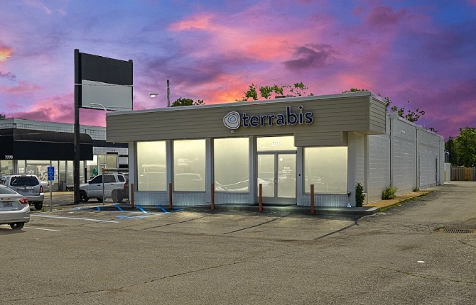 Terrabis Hazelwood Dispensary exterior with parking lot at sunset